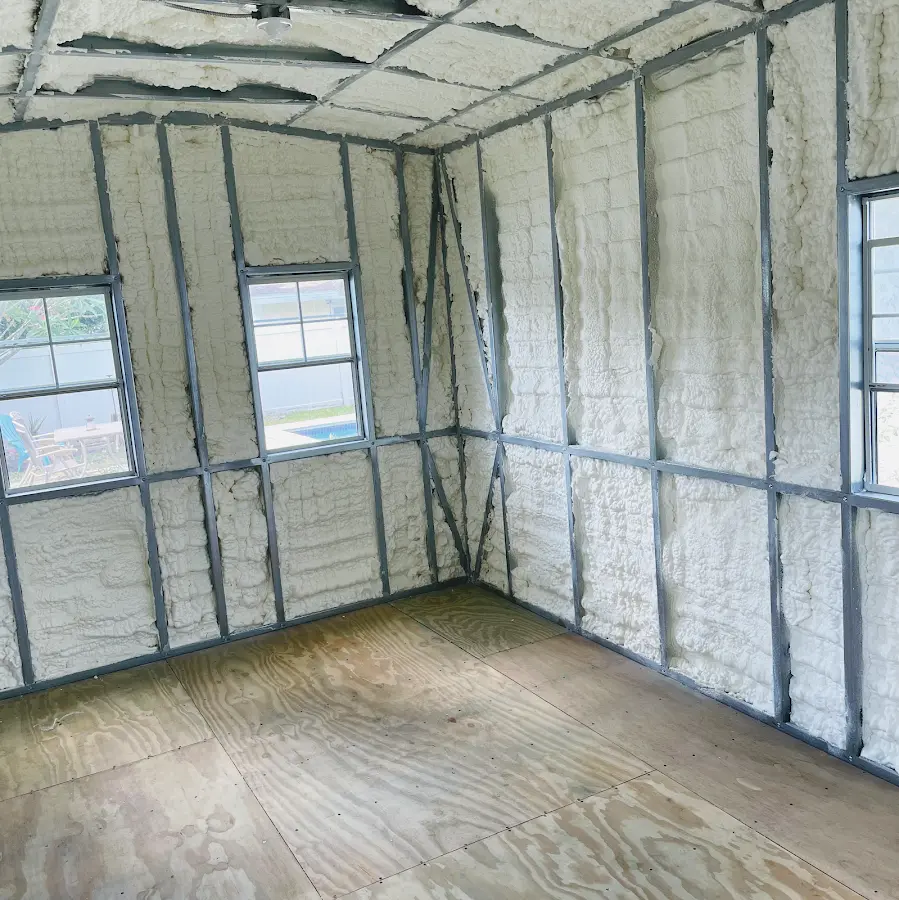 Closed-cell spray foam insulation applied to wall cavities in a residential project in Mableton